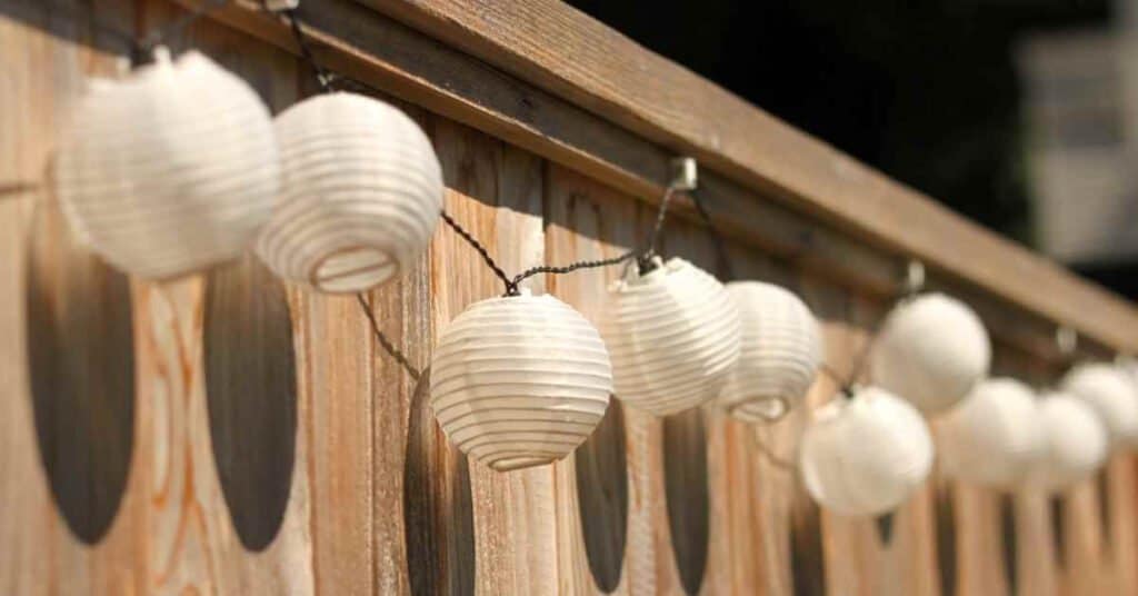 String Lighting Hanging Along Fencing
